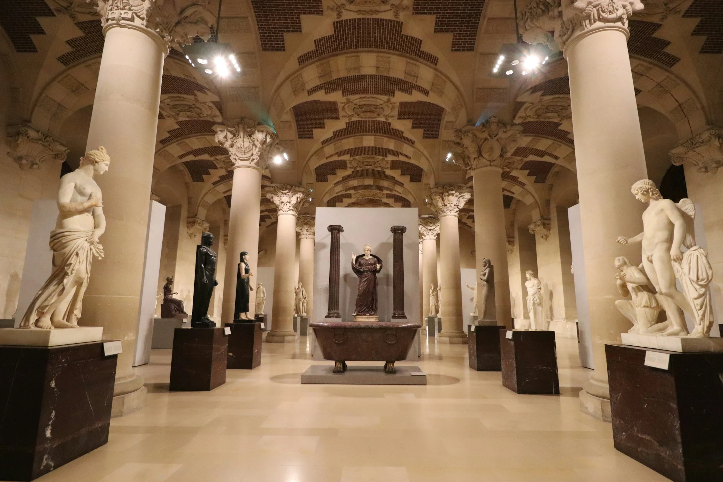 Classical sculptures in a museum hall