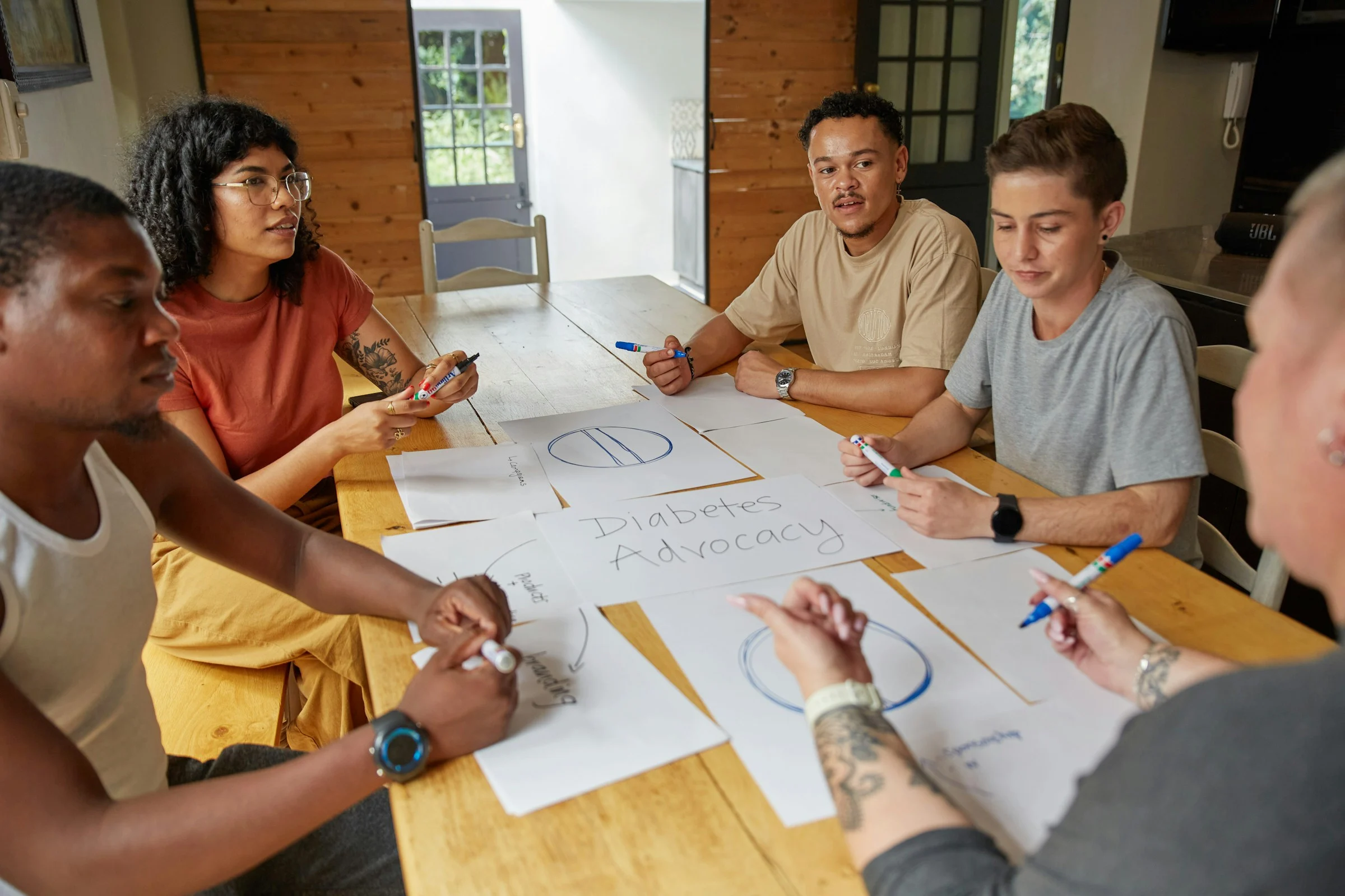 People sharing ideas around a table