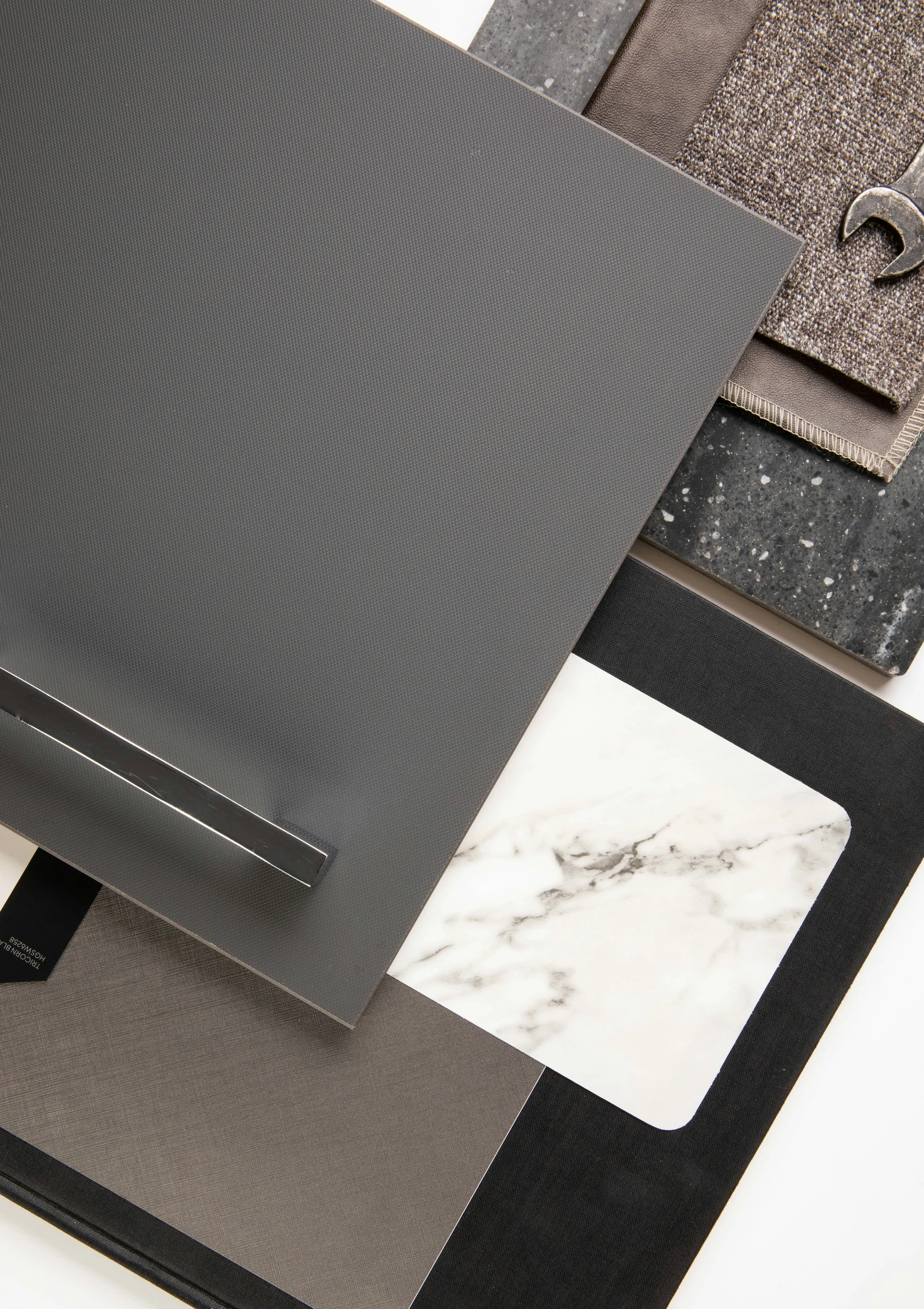 Material samples with contrasting textures and finishes arranged for comparison